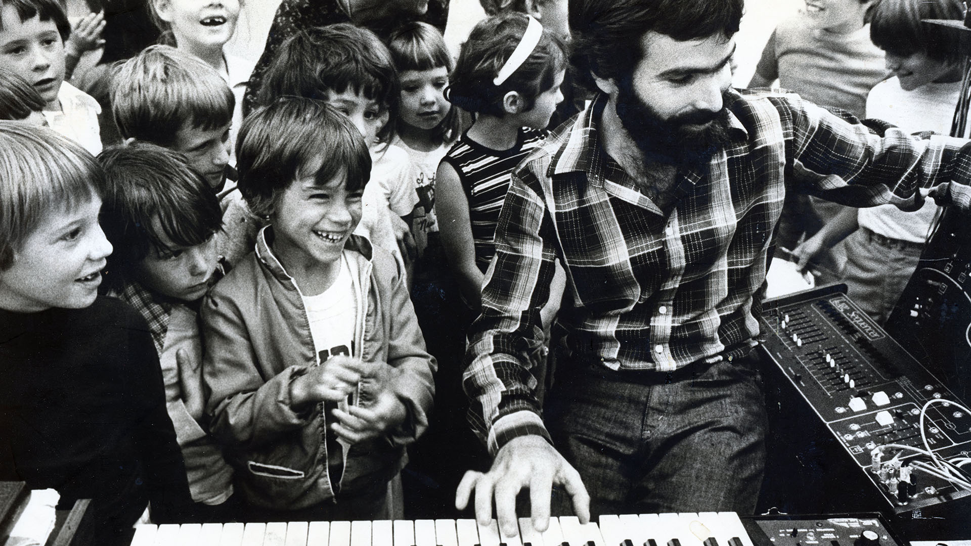 Kentyn Playing the Piano at School With Kids
